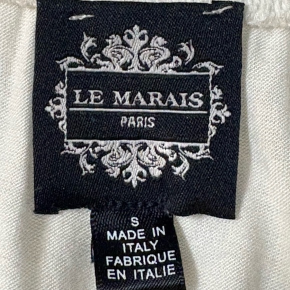 White silk made in Italy blouse. 3D flowers at v neckline. Ruffle front. - Picture 7 of 15